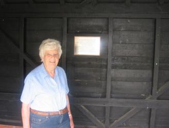 Local historian June Brereton admires the plaque in its final position